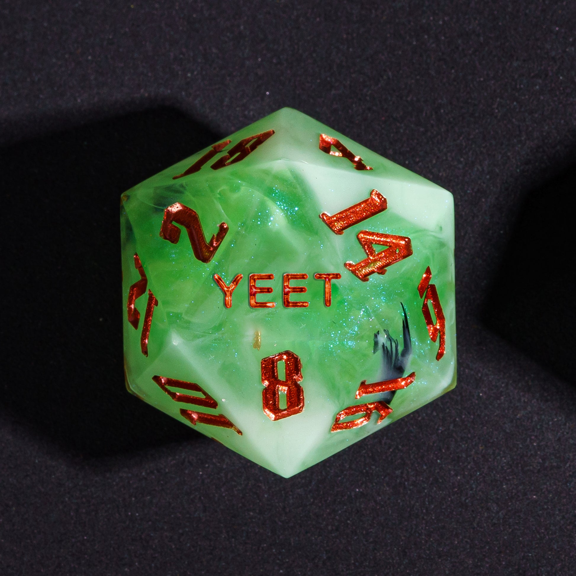 Close up Bog Hag Yeet D20 with green resin and red metallic numbers