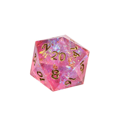 Close up of Celestial Heart Sharp Edge D20 featuring pink iridescent resin with gold numbering and holographic shimmer for DnD and tabletop RPGs