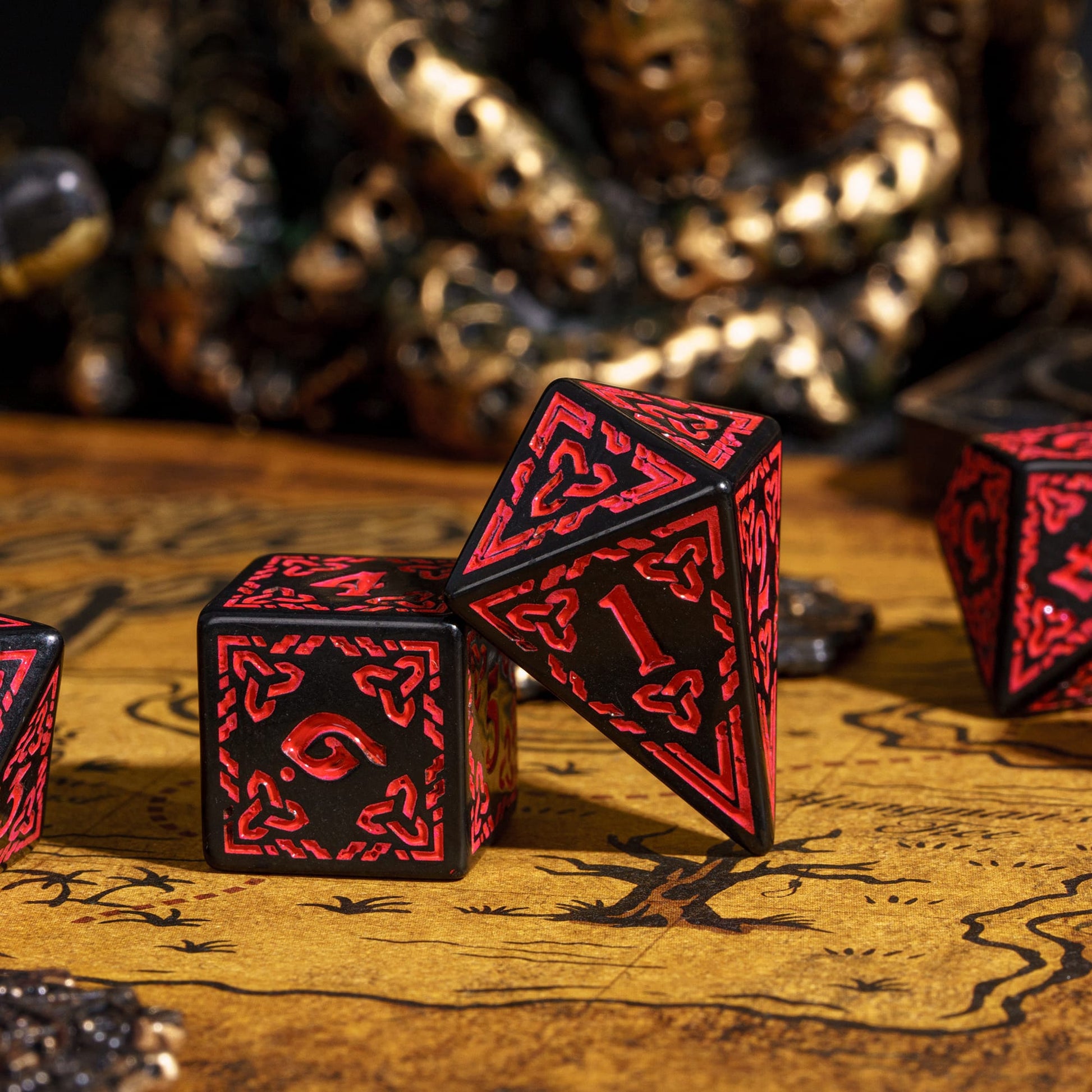 Celtic Knot Dice Set in black & red with d4 and d6 close-up on treasure map, dice for DND & DND 5e