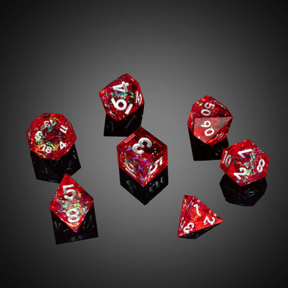 Angled view of Chromatic Blood sharp edge dice with vivid red detailing