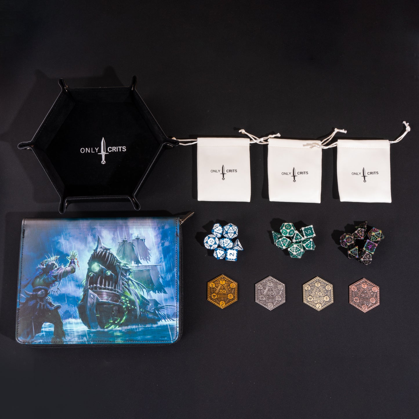 Collector's Dagger Dice Bundle arranged with three Dagger metal dice sets, premium dice binder, hexagonal dice tray, three dice bags, and four collectible inspiration coins