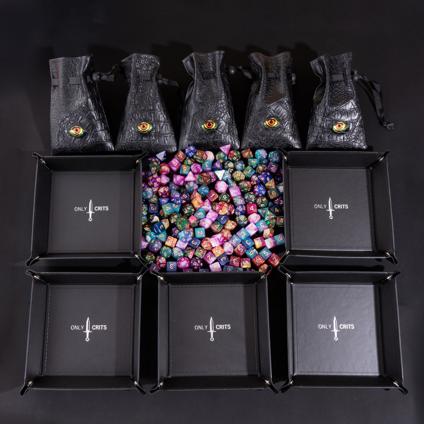 Collector's Multi Dice Bundle with five Dragon Eye dice bags, five premium dice trays, and a large assortment of colorful polyhedral dice for Dungeons & Dragons and tabletop RPGs.
