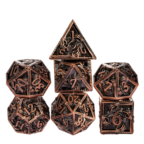 Copper Relic Metal Dice Set stacked with copper and black RPG dice