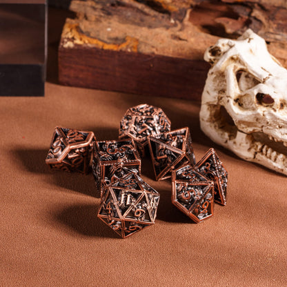 Copper Relic Metal Dice Set displayed on tabletop with skull decor