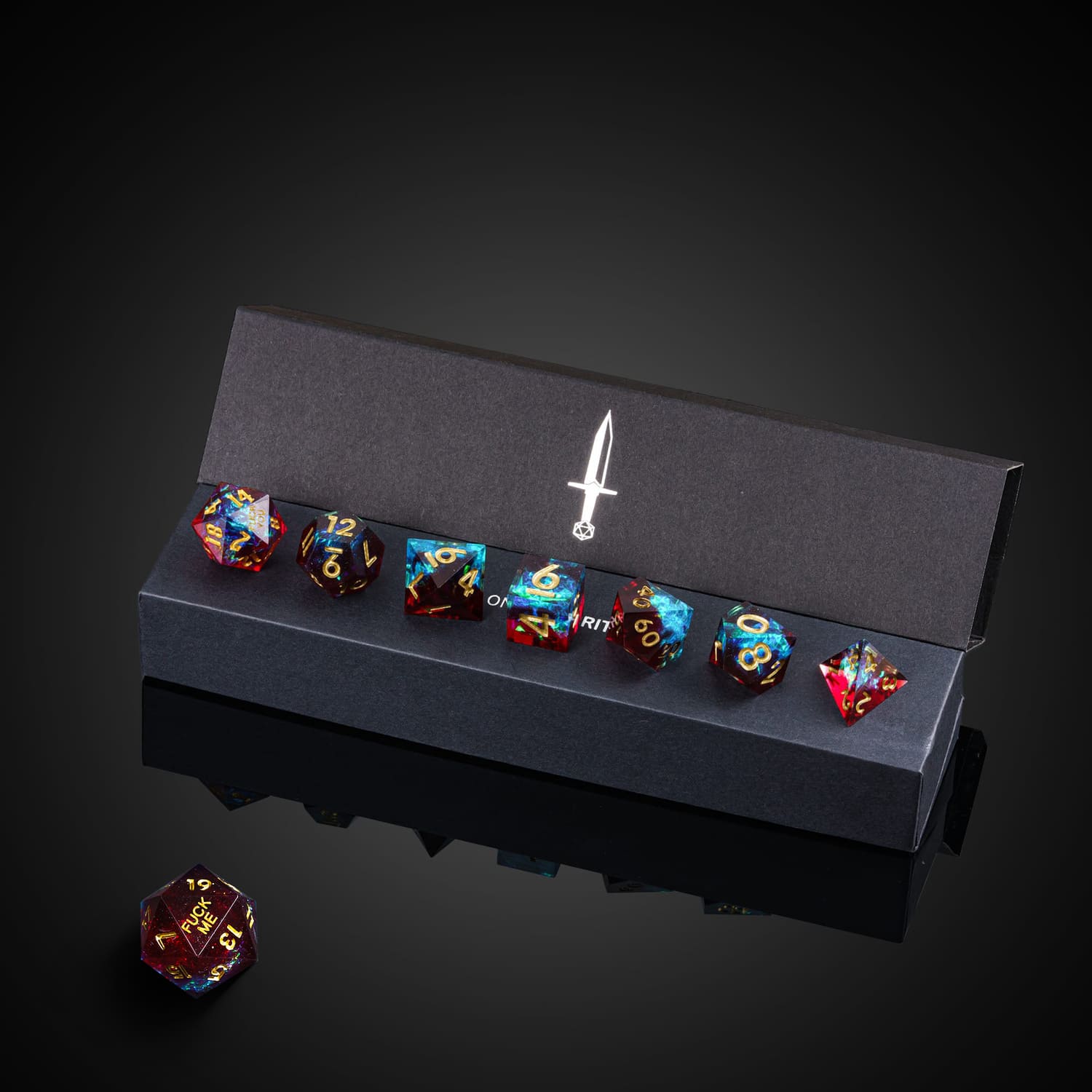 Corrupted Cobalt F*ck Me Sharp Edge Dice set in branded box with all seven dice visible