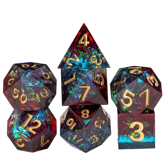 Stacked display of Corrupted Cobalt Sharp Edge Dice Set 7 piece polyhedral dice collection with deep cobalt resin and gold numbering for DnD