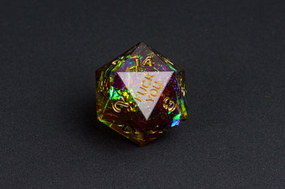 Close-up of the Corrupted Meadow F*ck Me sharp edge D20 with gold numbers and holographic shimmer