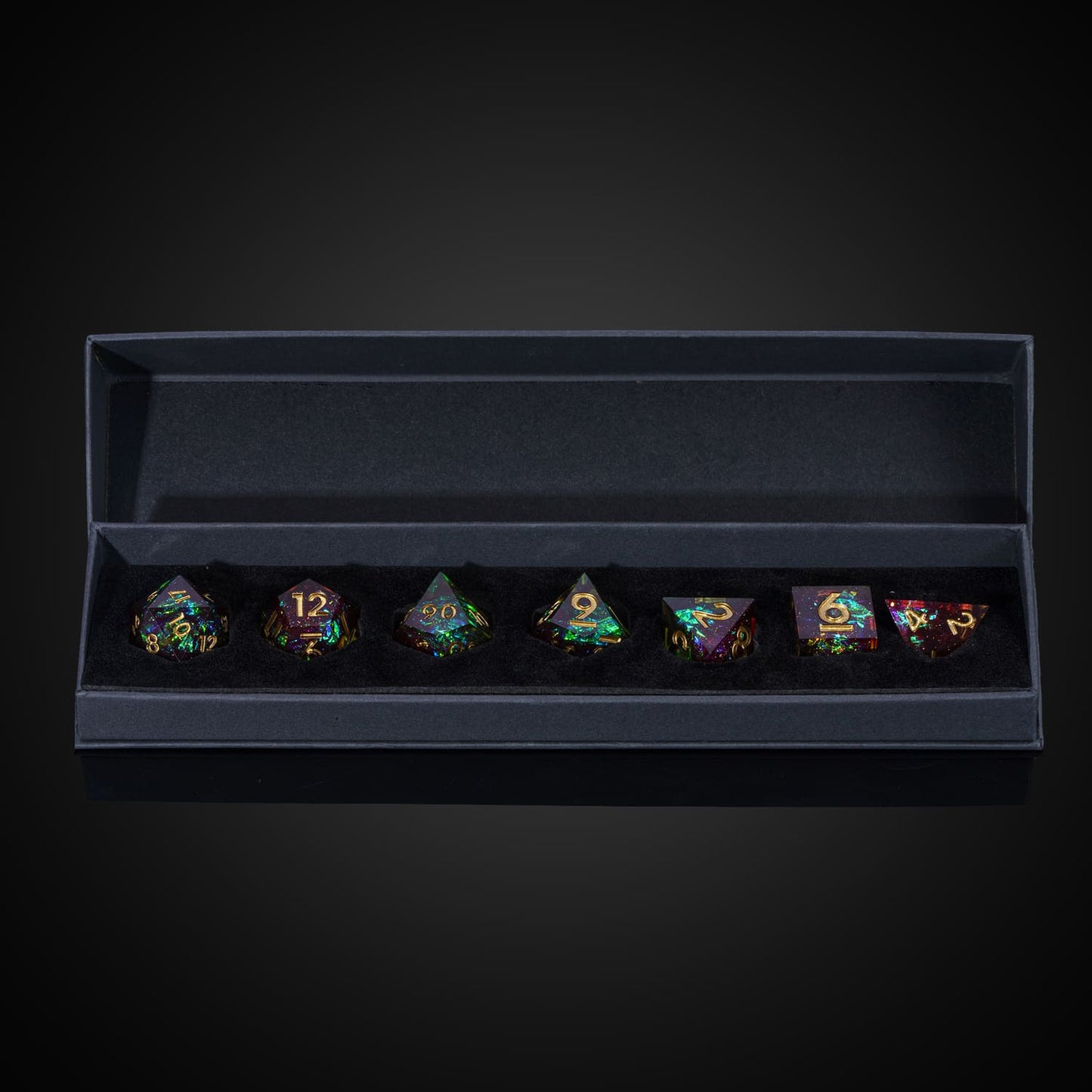 Open box display of Corrupted Meadow sharp edge dice set for DnD and DnD 5e