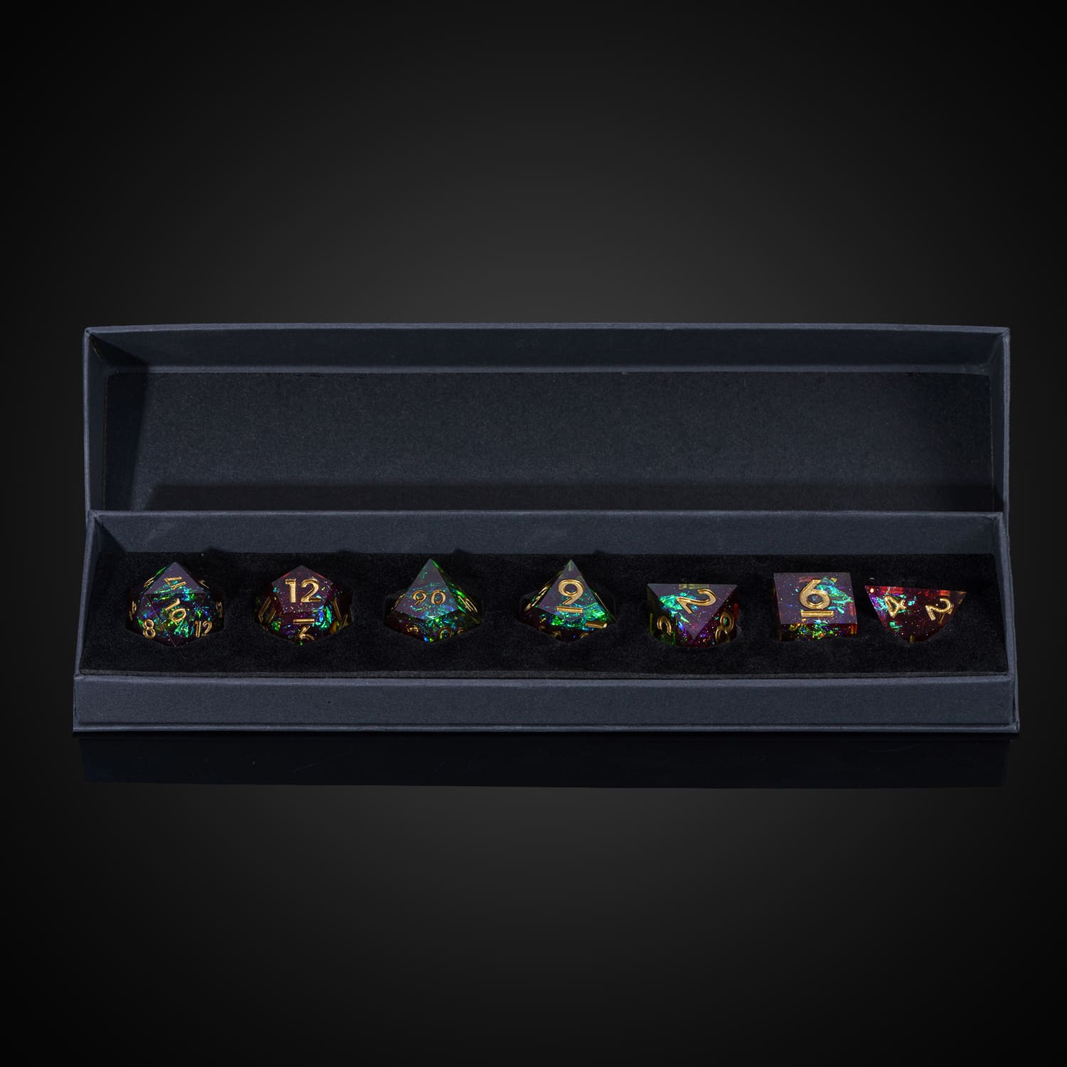 Open box display of Corrupted Meadow sharp edge dice set for DnD and DnD 5e