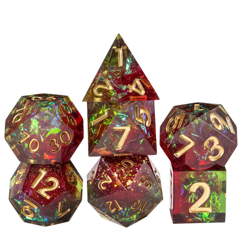 Stacked Corrupted Meadow sharp edge 7 piece resin dice set with red and green shimmer foil and gold numbers for DnD