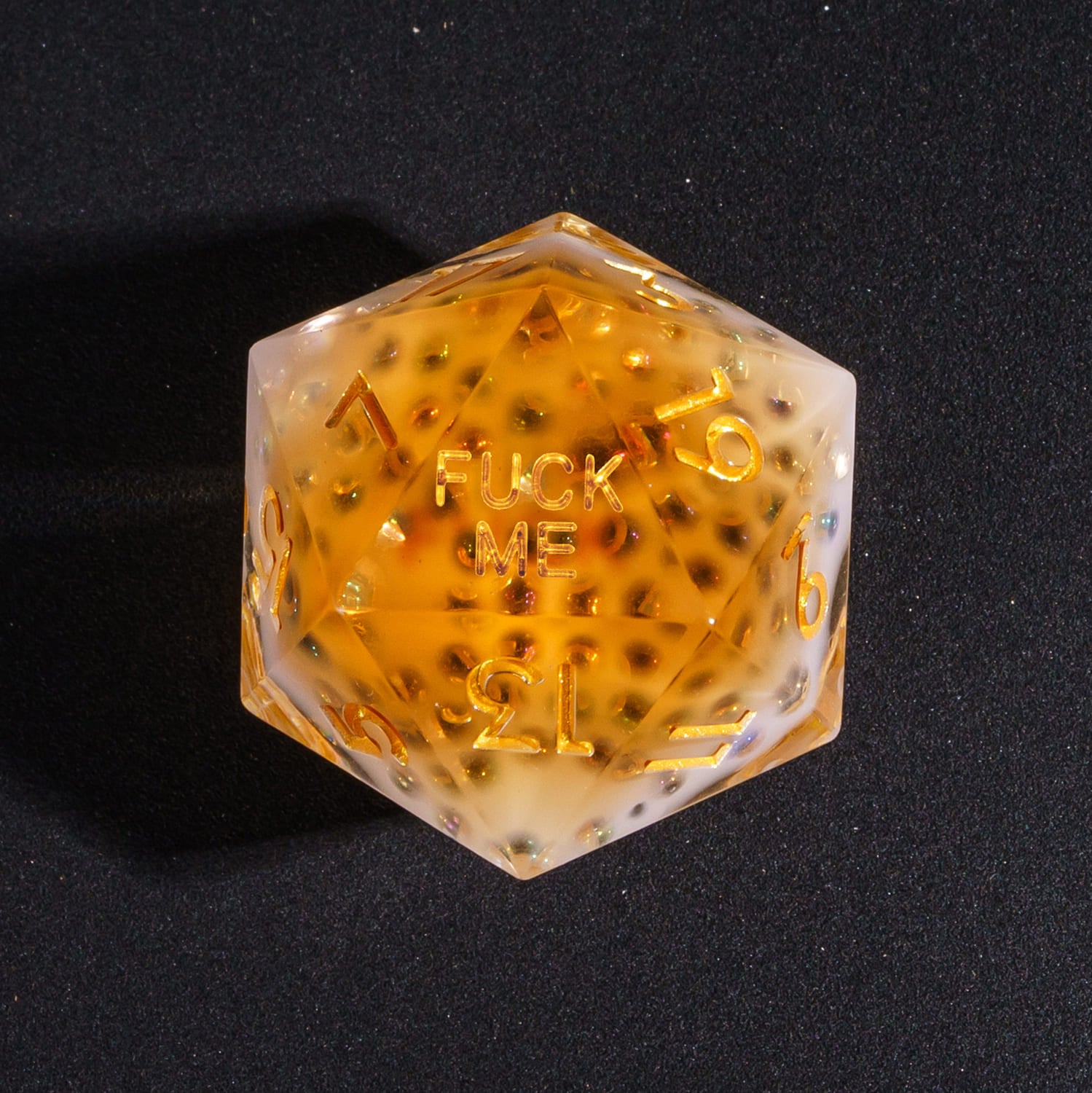 Close up of Crisp Brew Sharp Edge D20 with Fuck Me face for DnD dice