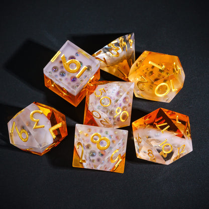 Crisp Brew Sharp Edge Dice Set grouped on black surface showing frosted resin and amber tones