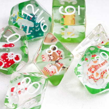 Angle shot of Critmas Crew Christmas Dice Set with snowman and holiday icons for DnD and TTRPG