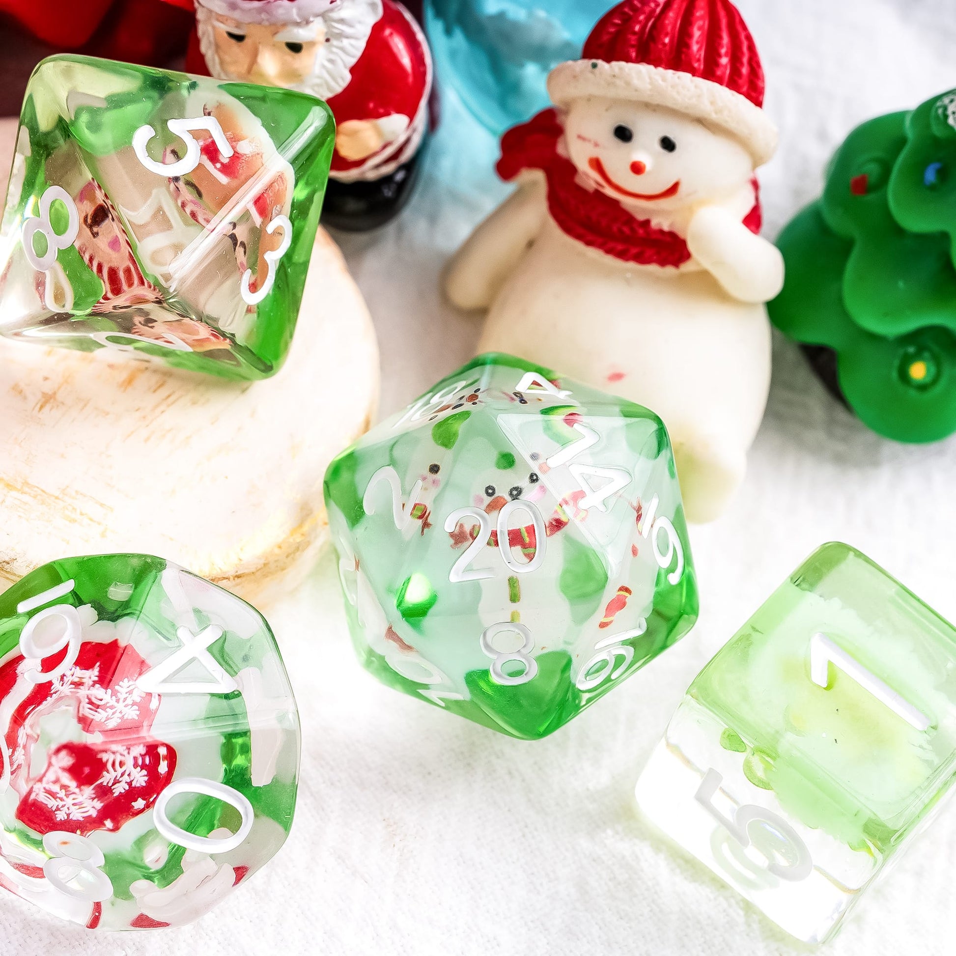 Christmas Critmas Crew Dice Set with holiday props and figures for DnD and tabletop roleplaying