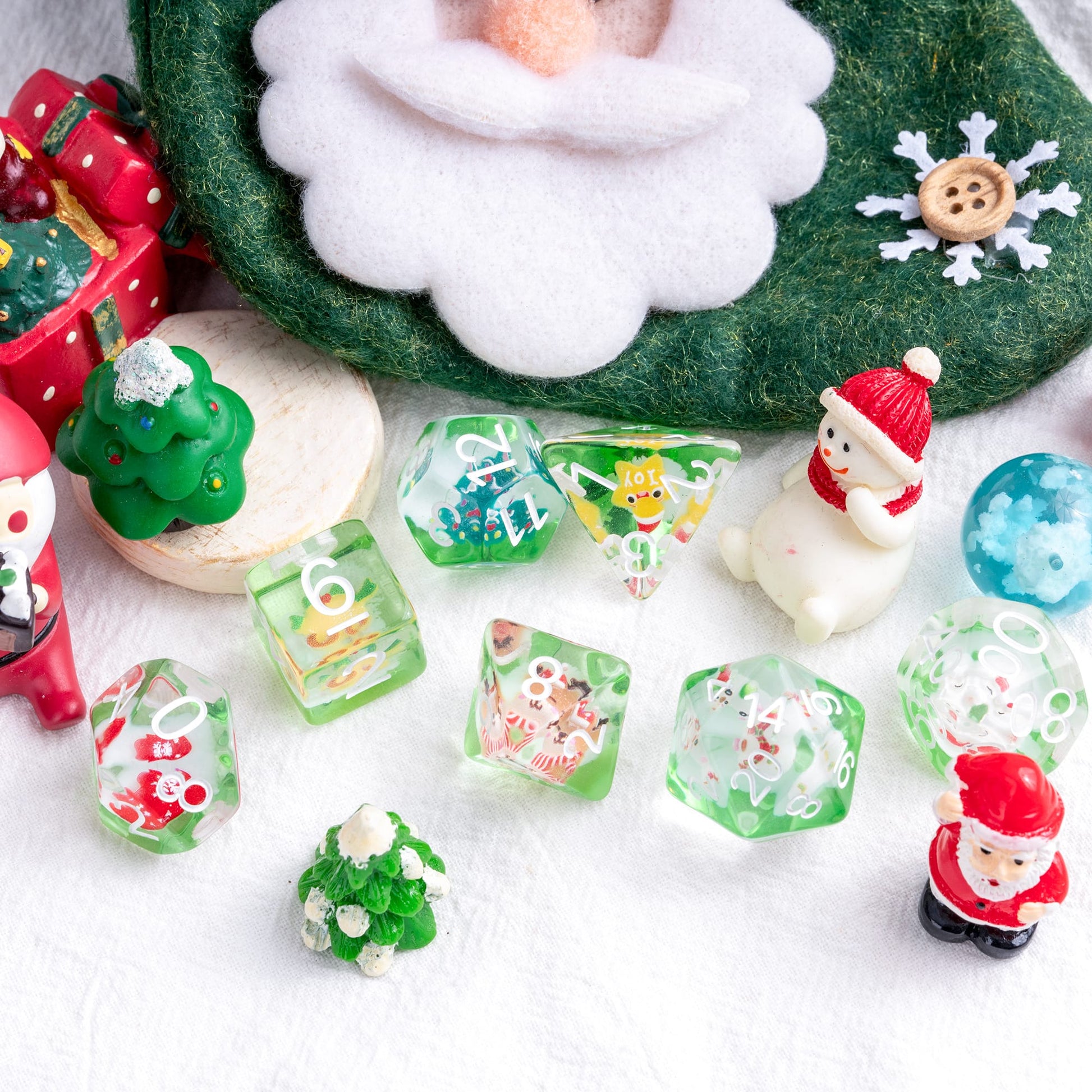 Christmas Critmas Crew Dice Set with holiday props and figures for DnD and tabletop roleplaying
