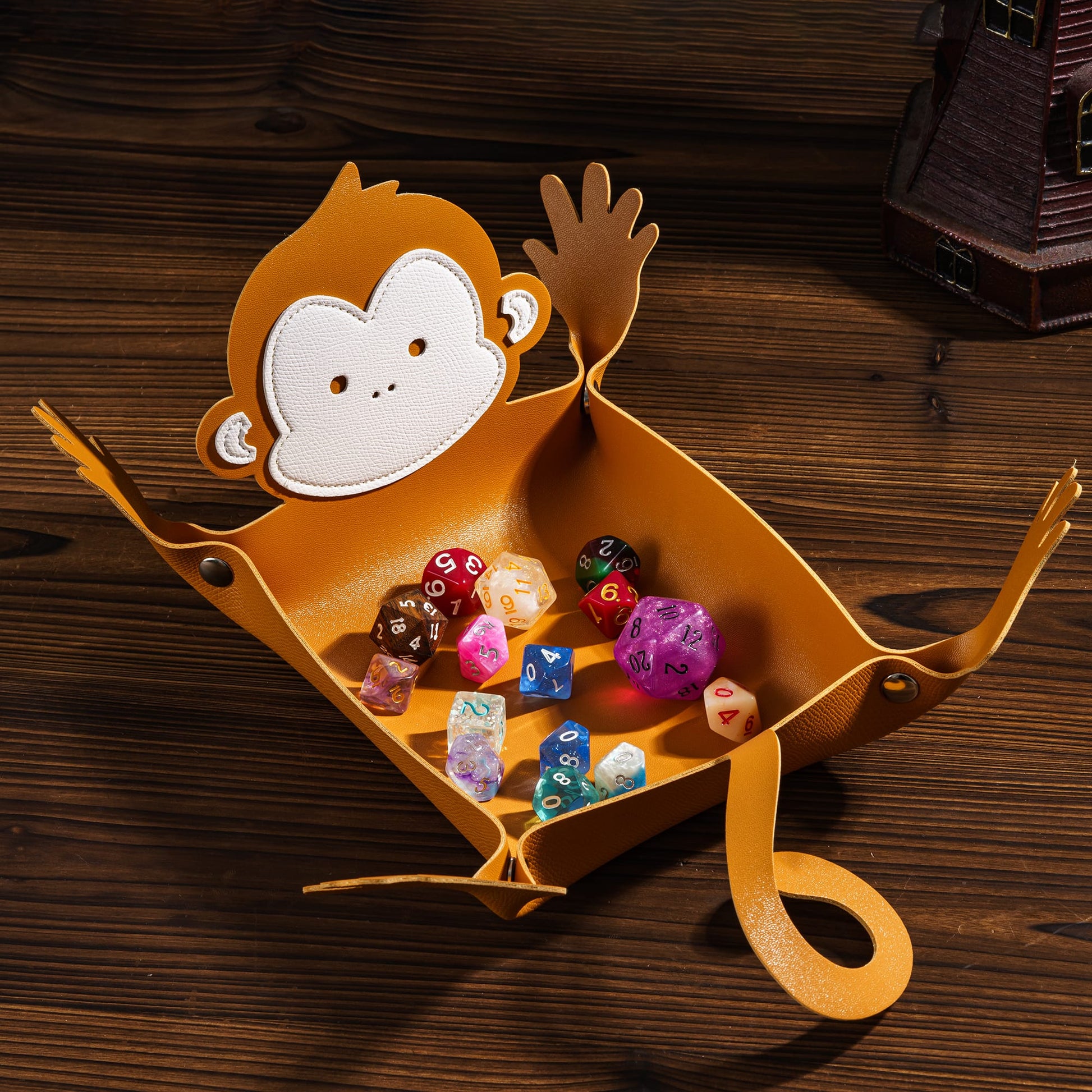 Monkey Critter Dice Tray holding polyhedral dice for DnD & DnD 5e tabletop play