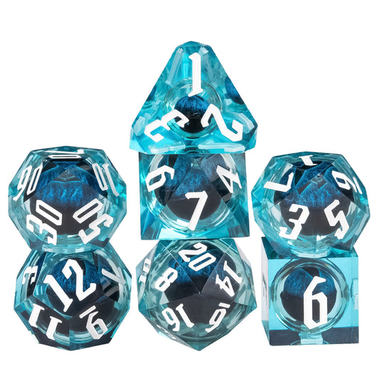 Dragon Eye Blue sharp edge dice set stacked display showing translucent teal resin and white numbering