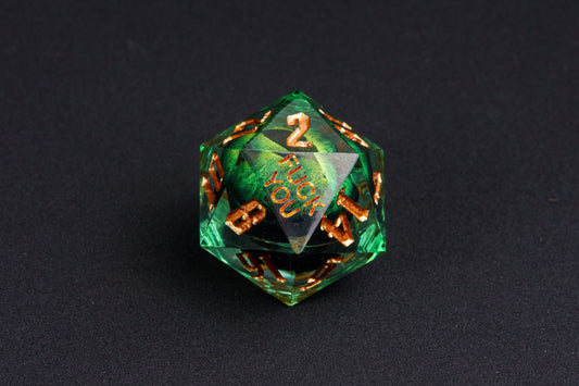Close-up of Dragon Eye Green Fck Me Sharp Edge D20 die showing Fck You face with emerald eye design