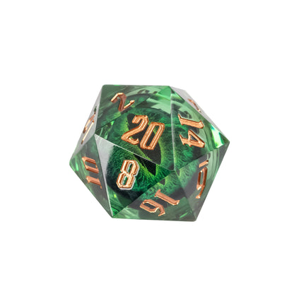 Green Dragon Eye sharp edge D20 with translucent emerald resin, suspended dragon eye core, and metallic gold engraved numbers