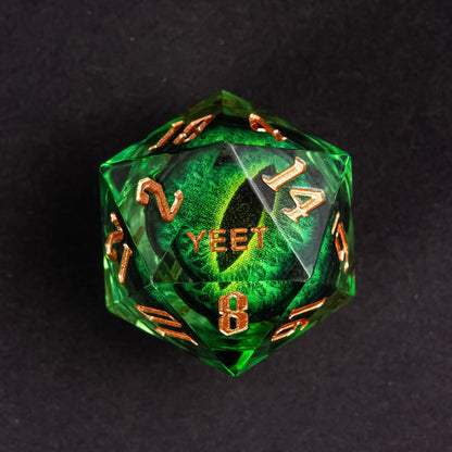 Close-up of Dragon Eye Green Yeet Sharp Edge D20 die showing Yeet face with emerald eye design