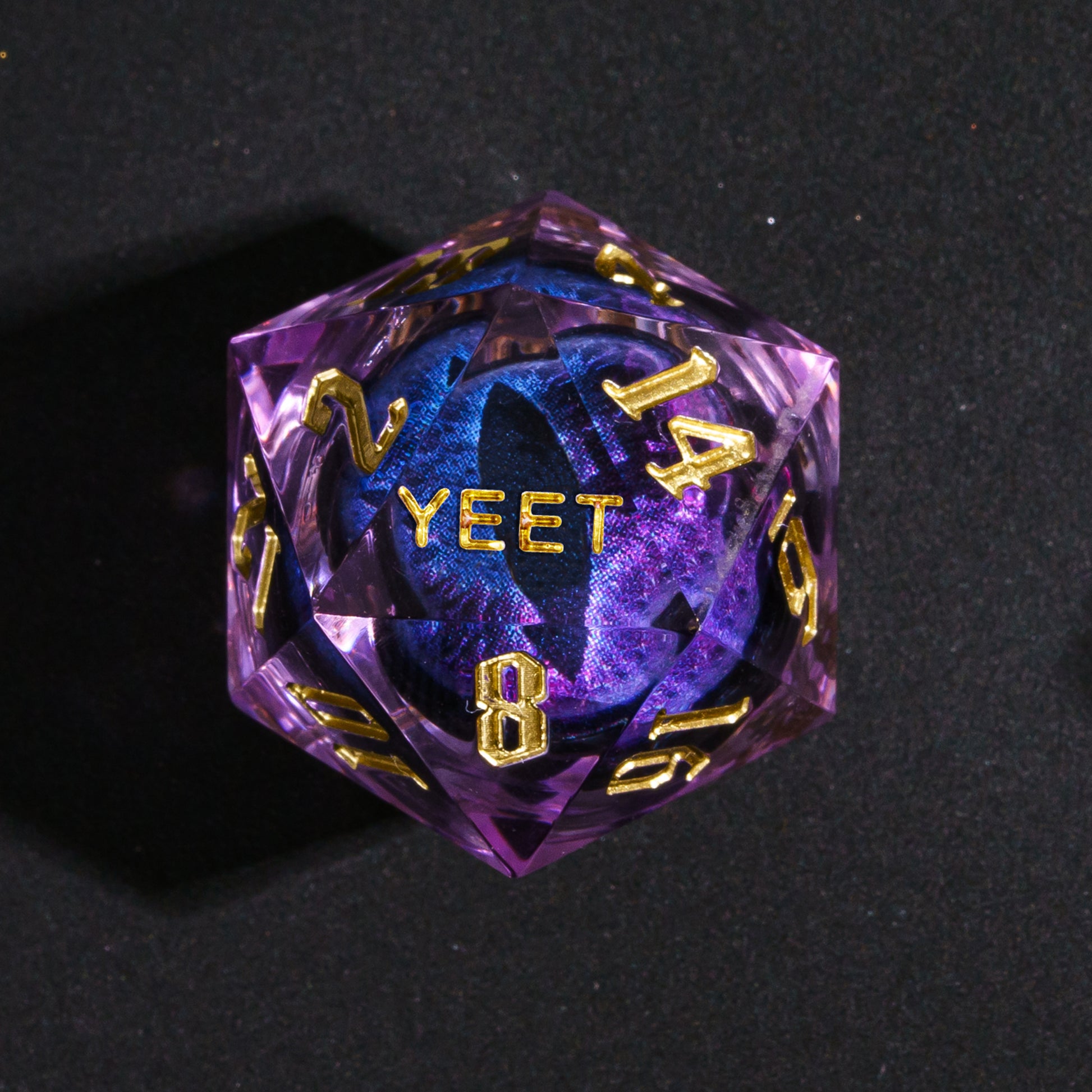 Close up of Dragon Eye Purple Sharp Edge D20 with YEET face for DnD dice