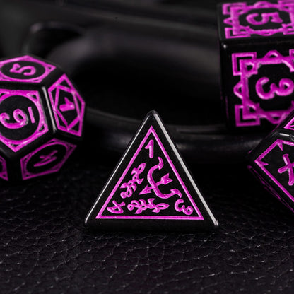 Close-up of black & purple D4 die from the Druidic Life Dice Set