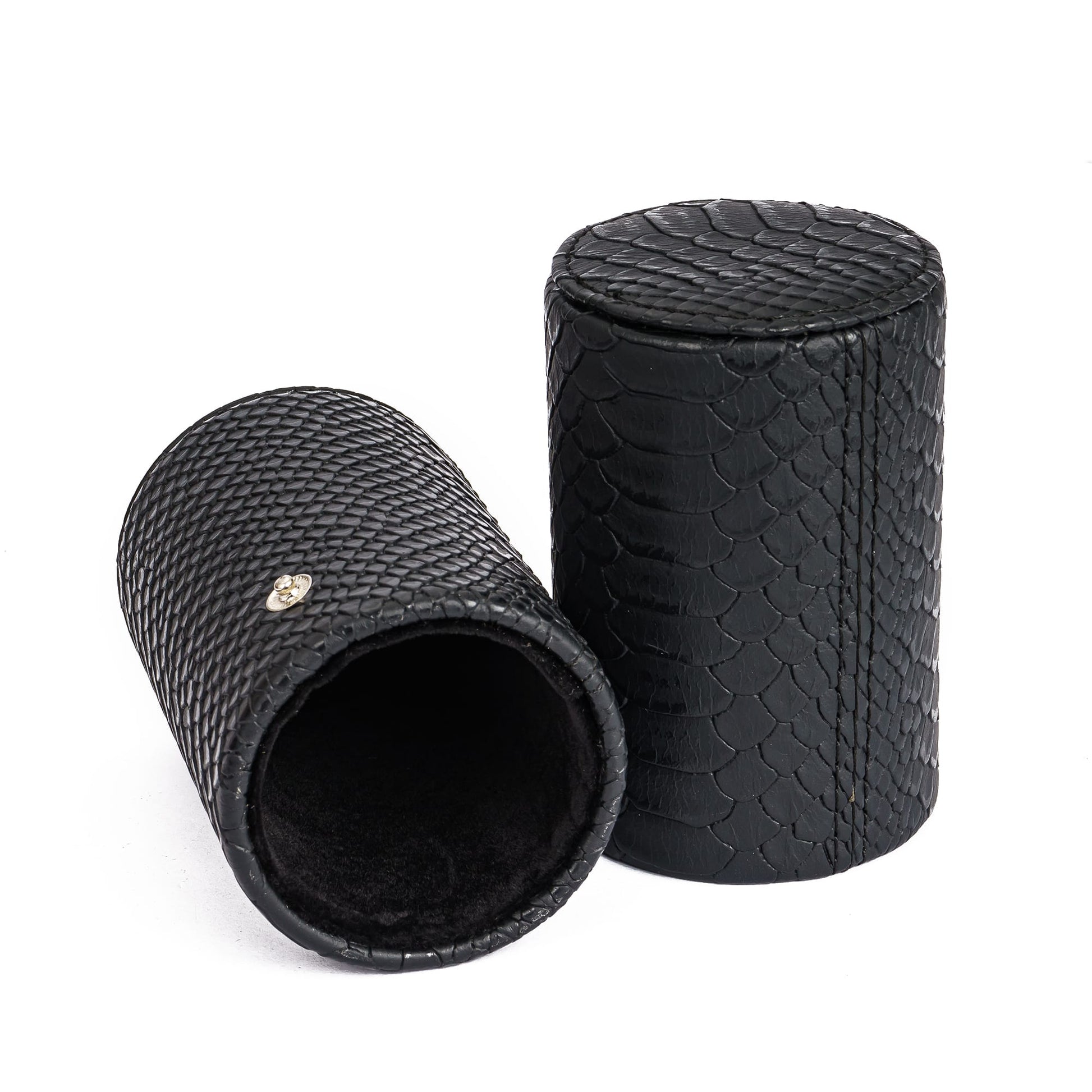 Black cylindrical dice storage tube with textured scales from the Dungeon Master Dice Tray & Case for DnD