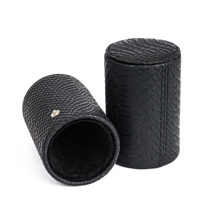 Black cylindrical dice storage tube with textured scales from the Dungeon Master Dice Tray & Case for DnD