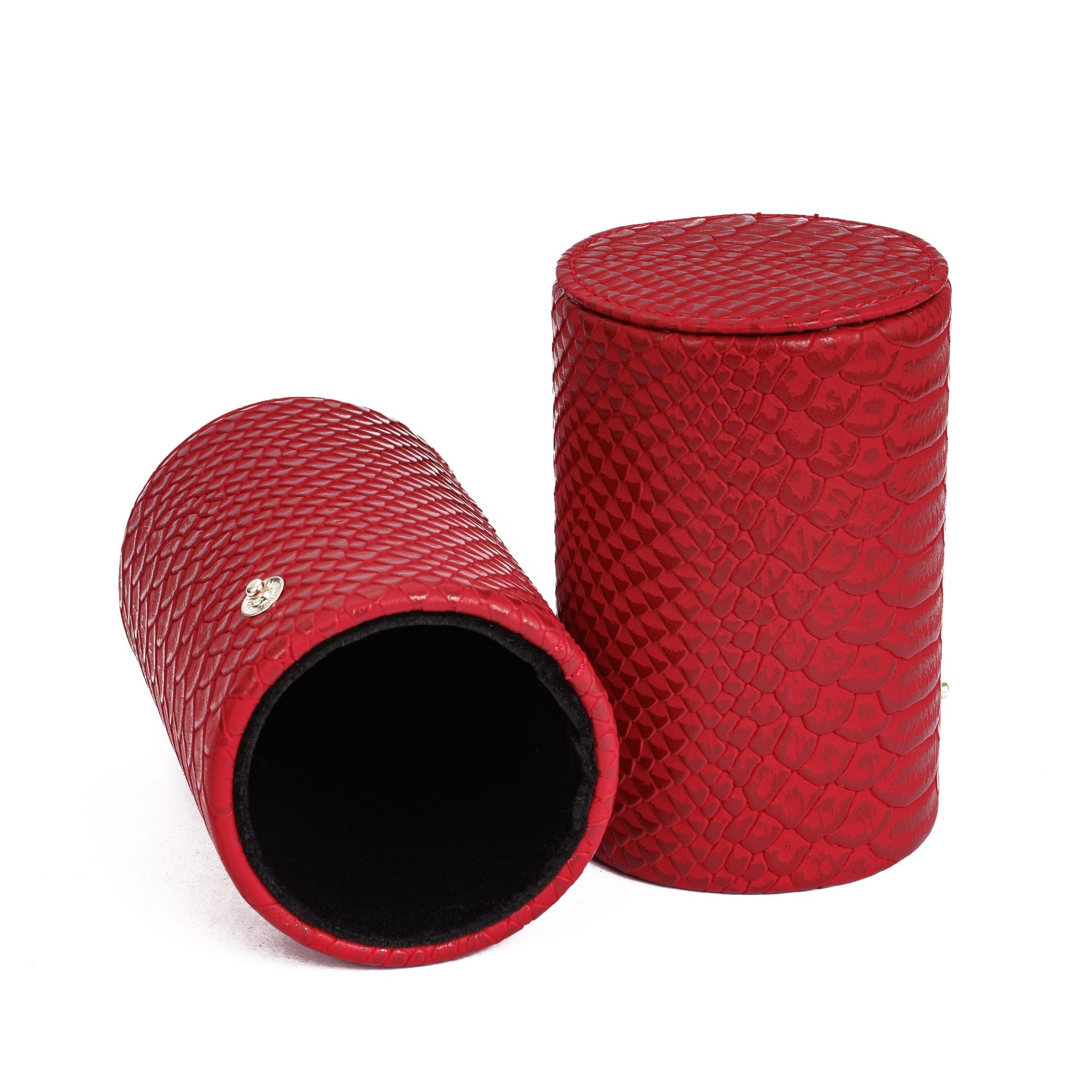 Red cylindrical dice storage tube with scale texture from the Dungeon Master Dice Tray & Case for DnD