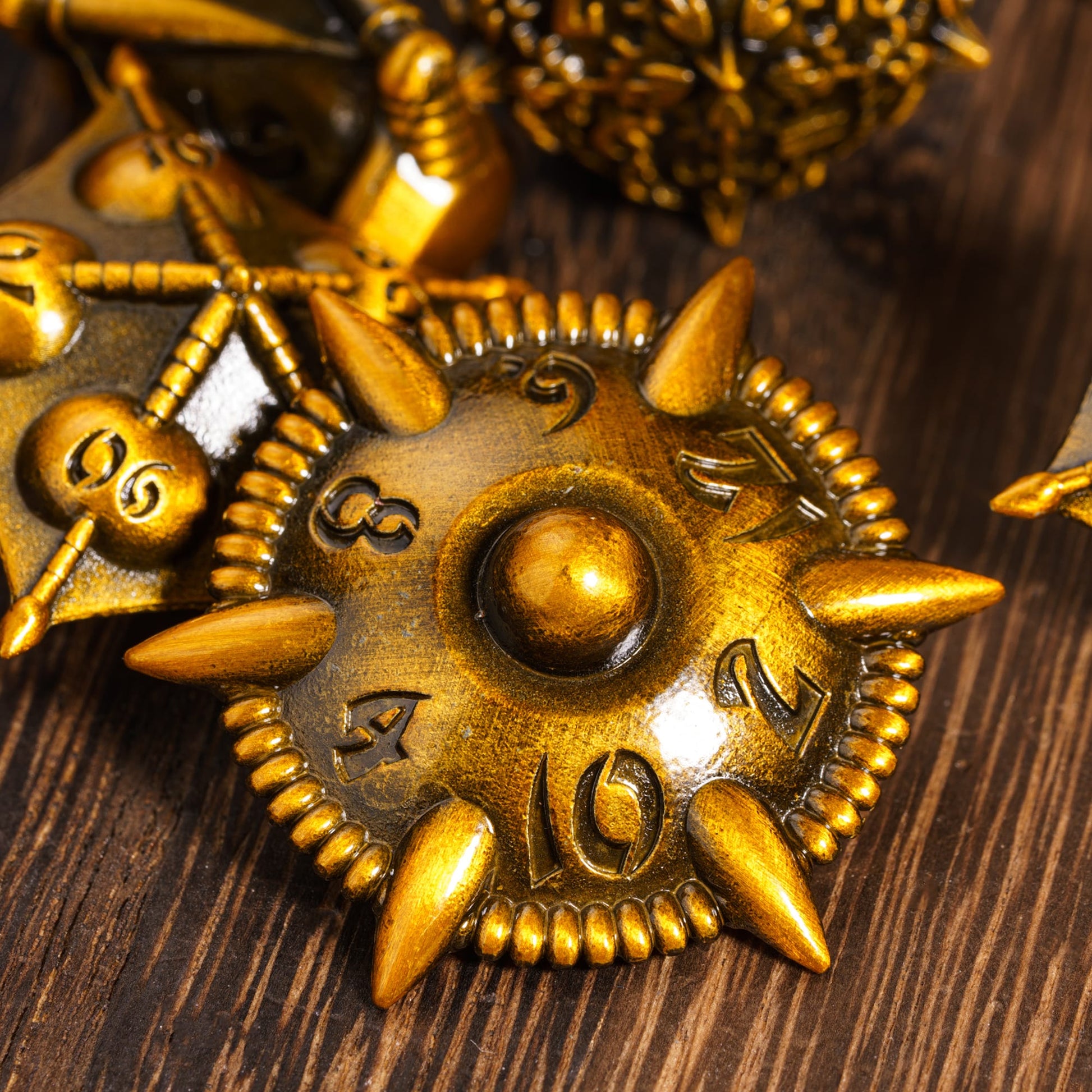 Spiked d12 die from Eldritch Edge Metal Dice Collection Ancient Gold for RPGs like Pathfinder & DnD