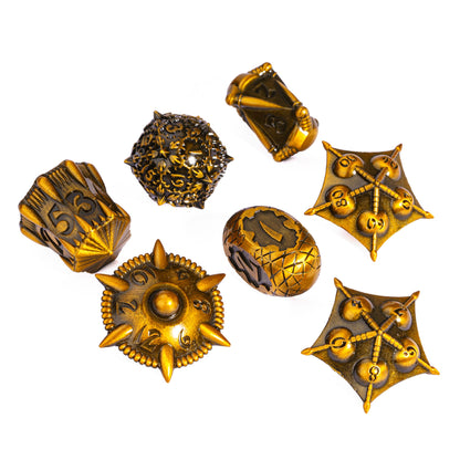 Close-up of spiked d20 from Eldritch Edge Metal Dice Collection Ancient Gold for Dungeons & Dragons