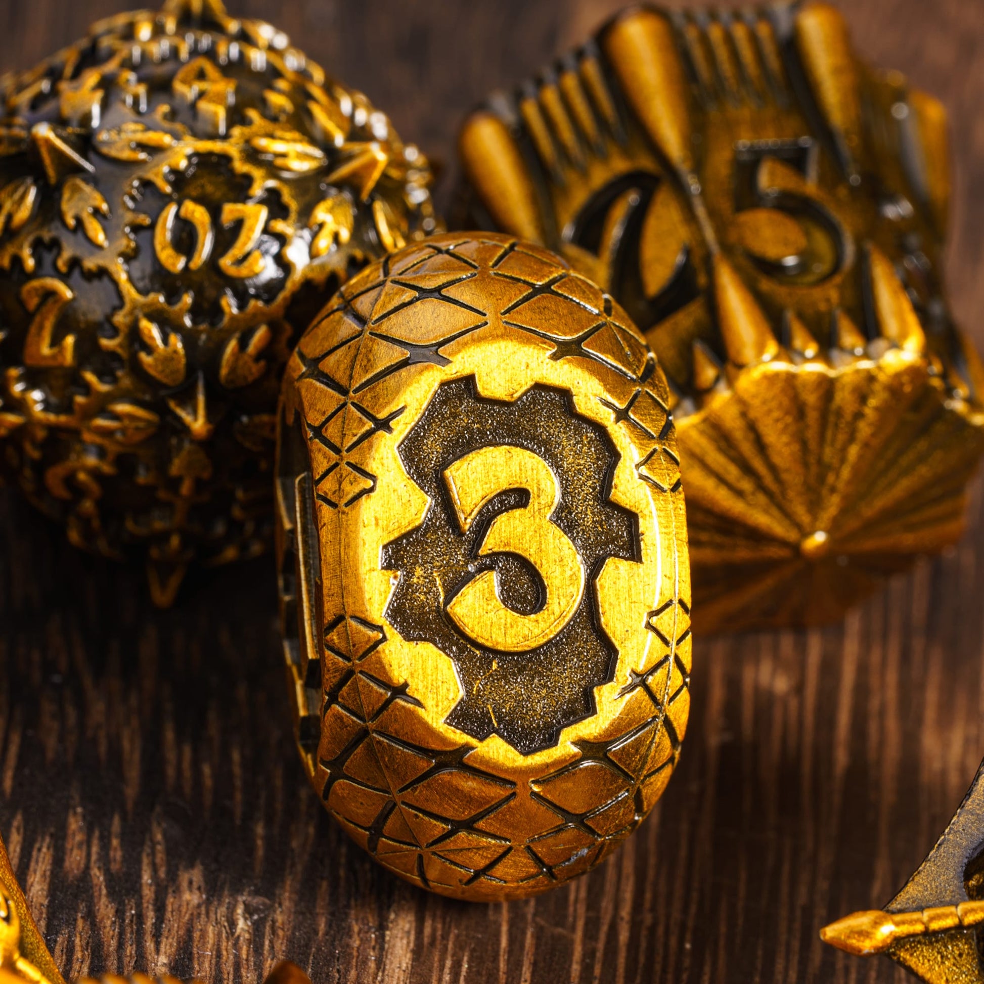Unique oval d4 die from Eldritch Edge Metal Dice Collection Ancient Gold, metal RPG dice set