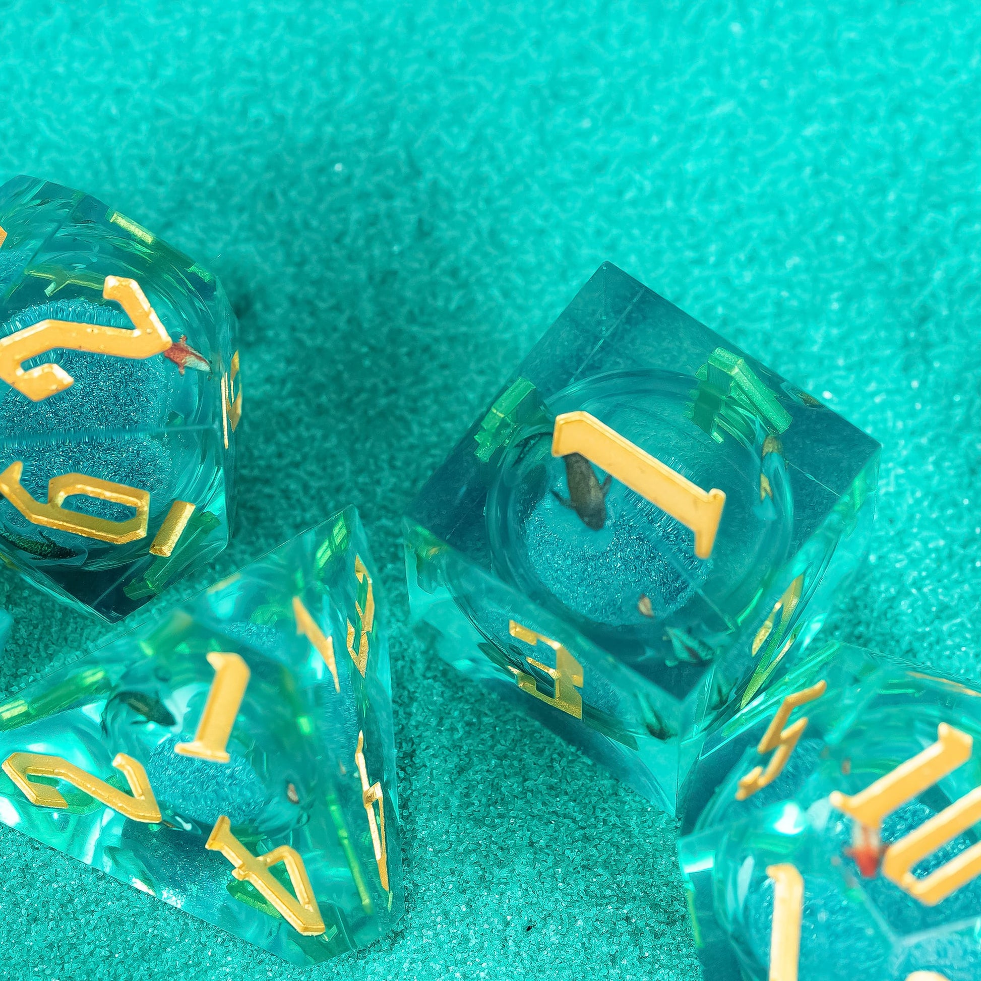 Celestial Reef sharp edge dice group display in teal resin with gold numbering