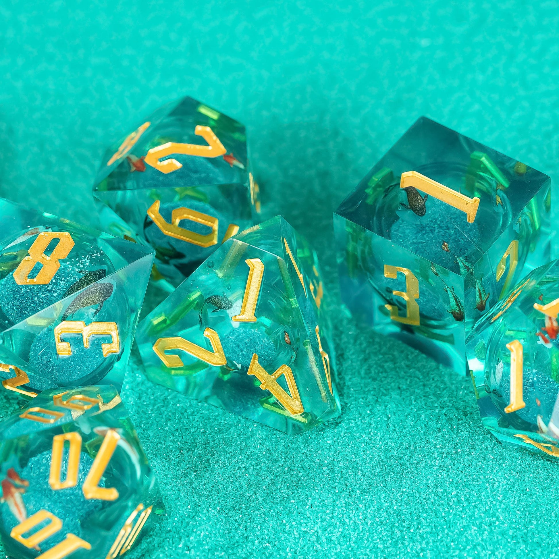 Top view of Celestial Reef sharp edge dice arranged on teal textured surface