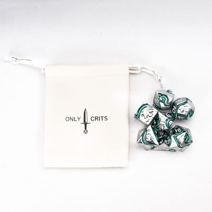 Emerald Serpent metal dice set with Only Crits dice pouch on white background