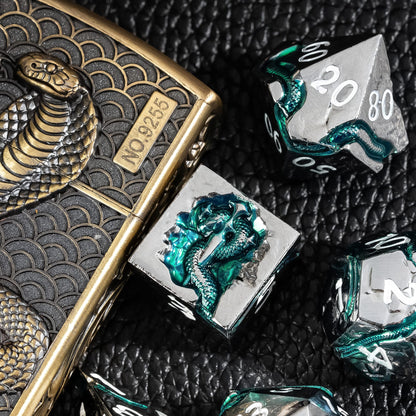 Emerald Serpent metal dice displayed with engraved serpent metal dice case
