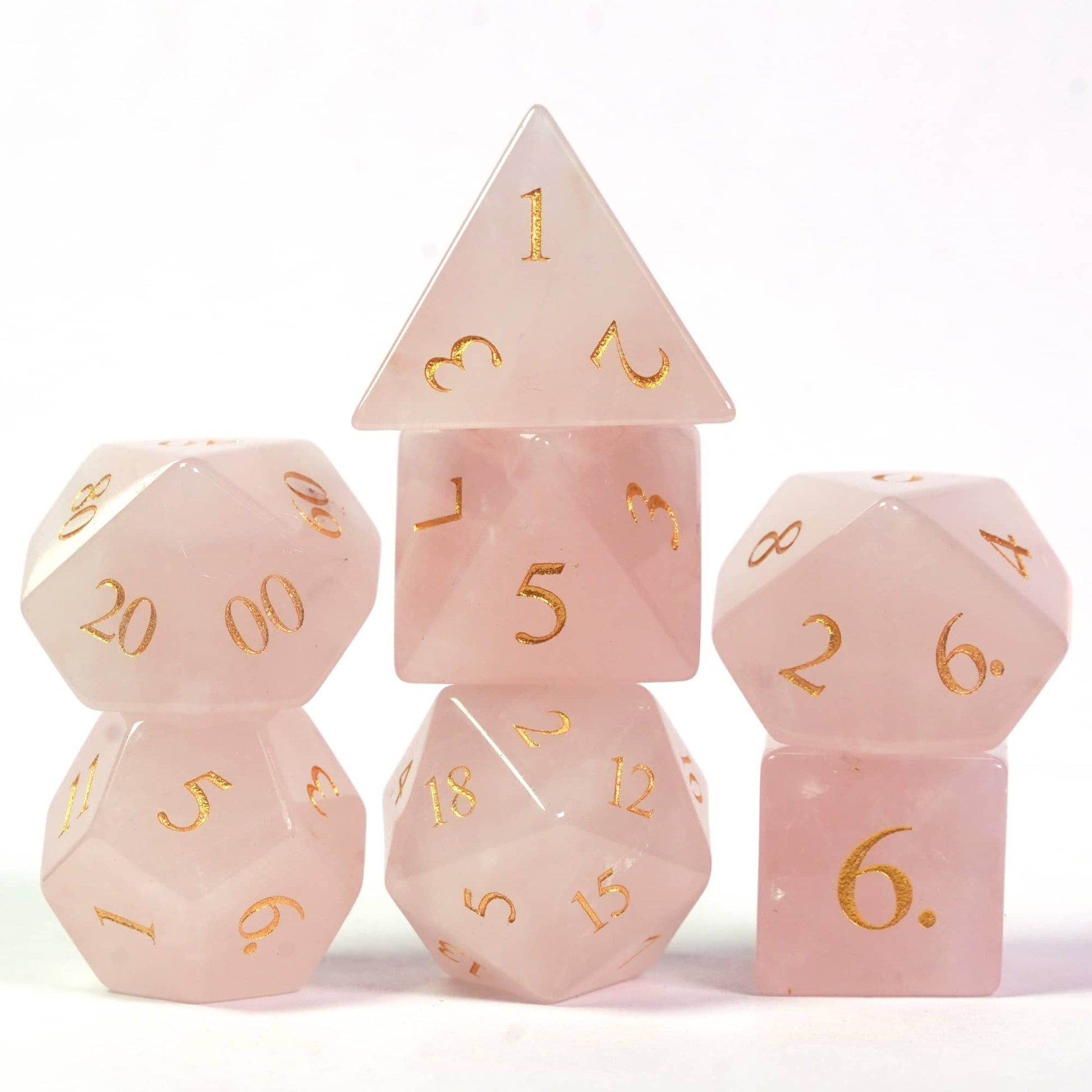 Stacked Fey Rose Fabled Crystals stone dice set for DnD & TTRPGs, 7 piece pink gemstone dice collection
