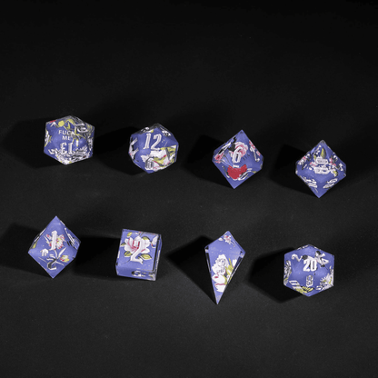 Flat lay of Floral Eclipse Sharp Edge Dice Set with floral art for DnD sessions