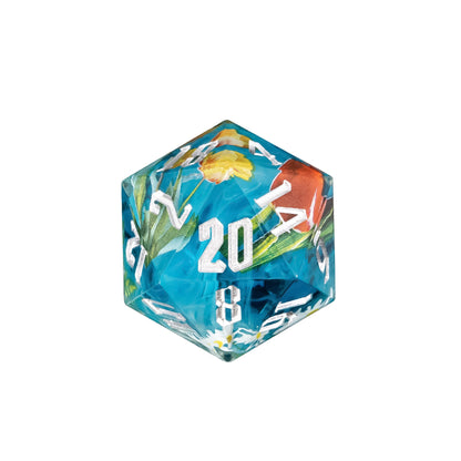 Sharp edge D20 from the Floral Mist dice set with blue resin, embedded flowers, and white numbers for DnD and tabletop RPGs