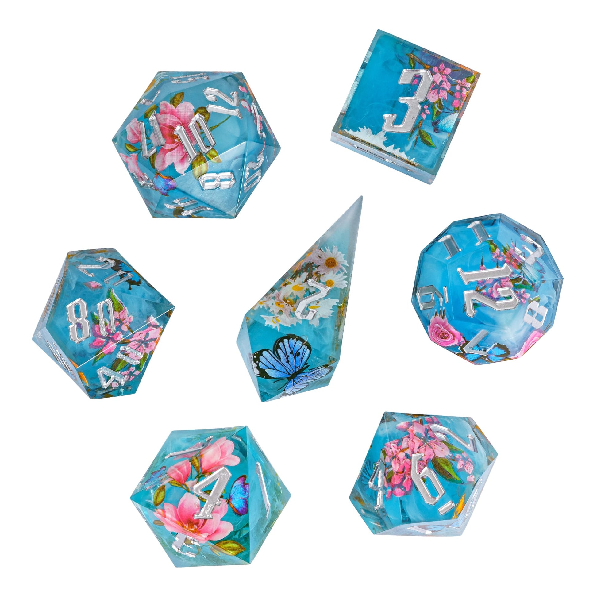 Flat lay of Floral Mist Sharp Edge Dice Set, 7 piece resin dice collection for Dungeons & Dragons 5e
