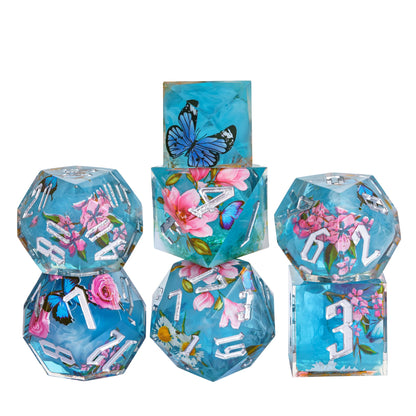 Stacked display of Floral Mist Sharp Edge Dice Set, 7 piece polyhedral dice for DnD & DnD 5e