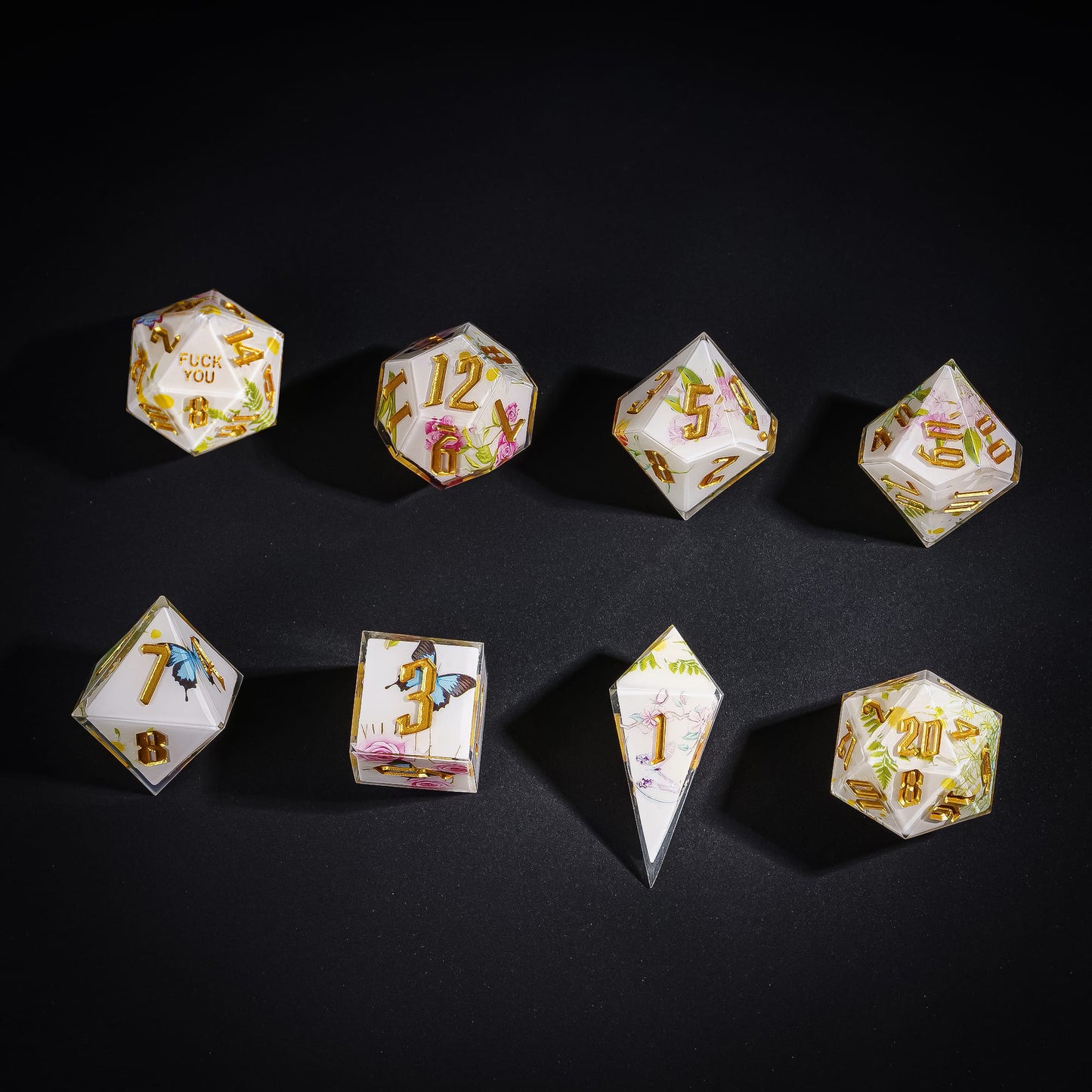 Flat lay of Floral Radiance Sharp Edge Dice Set with floral designs