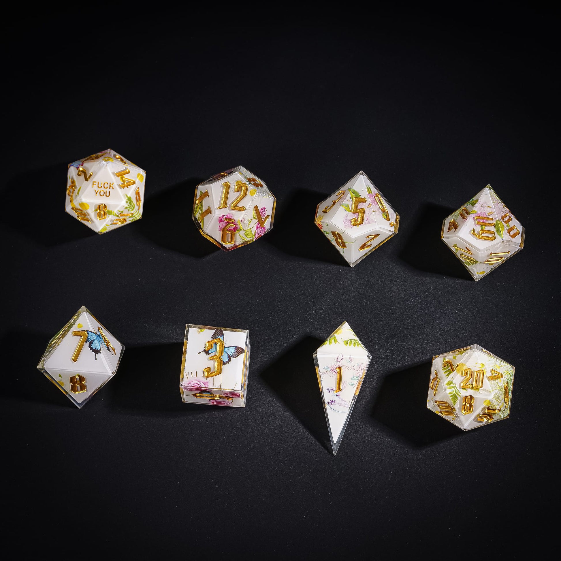 Flat lay of Floral Radiance Sharp Edge Dice Set with floral designs
