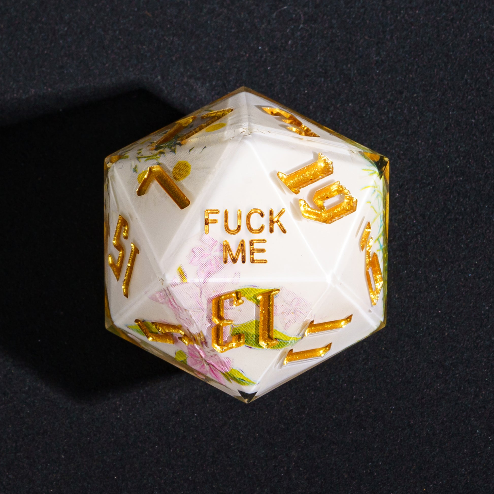 Close up Floral Radiance Fuck Me D20 with flowers and gold numbers