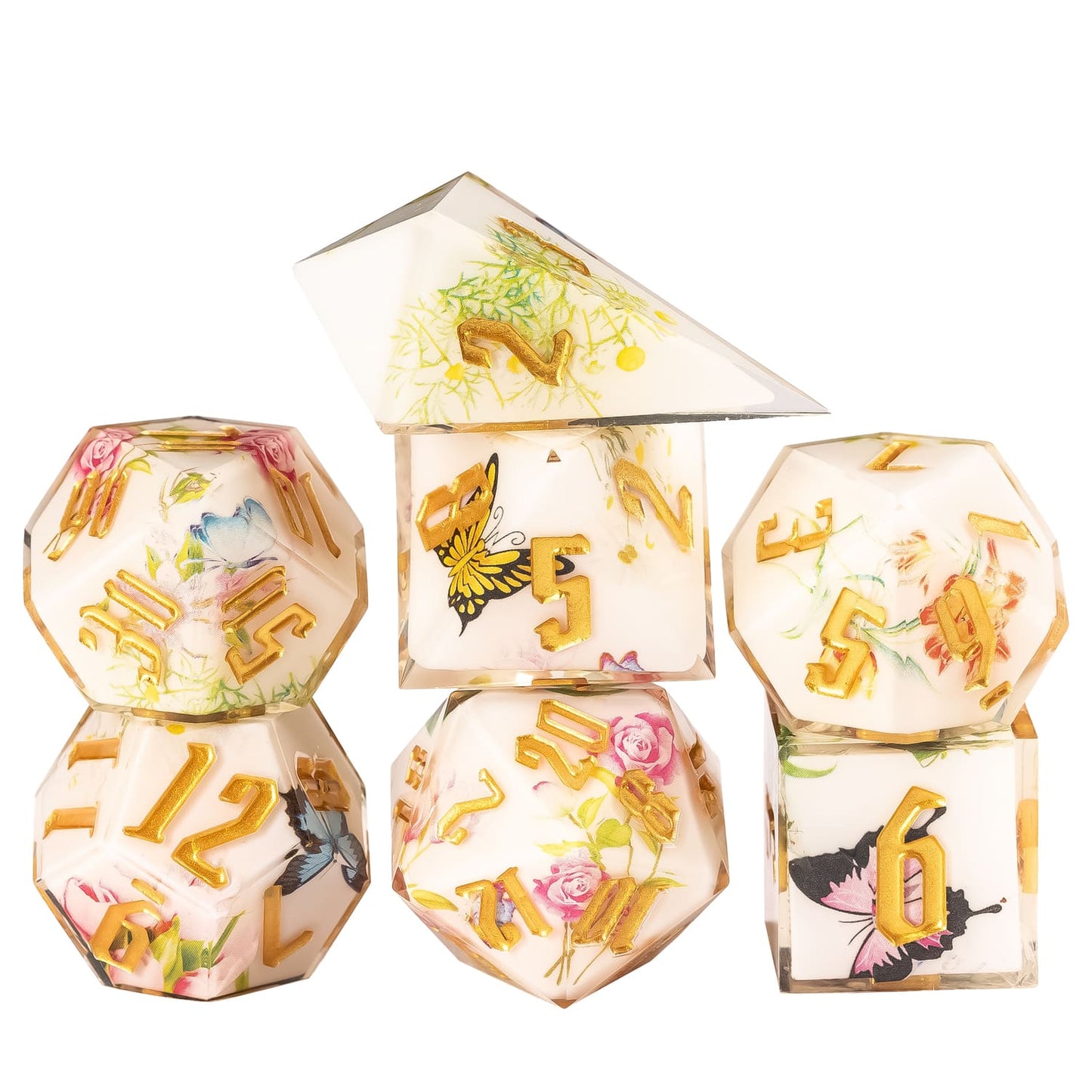 Floral Radiance Sharp Edge Dice Set stacked display featuring ivory resin dice with floral and butterfly designs and metallic gold numbers