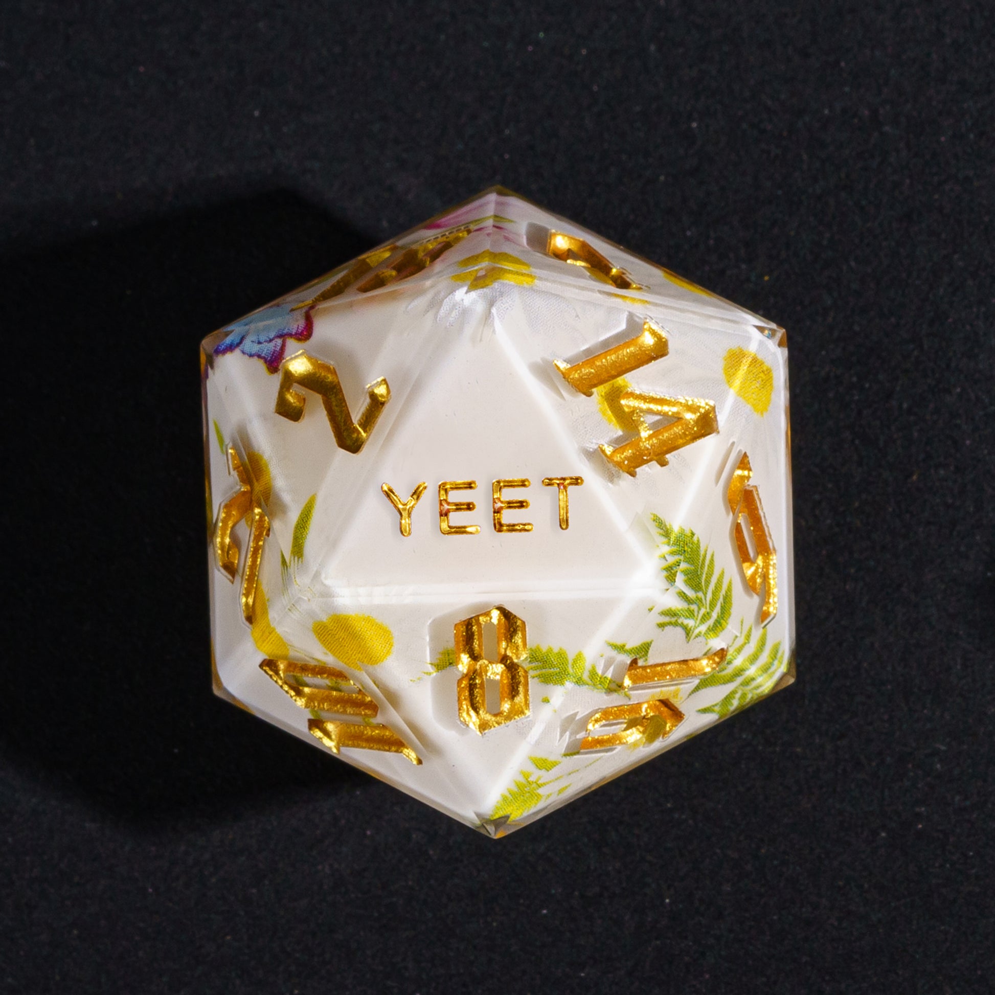 Close up Floral Radiance Yeet D20 with floral graphics and gold ink