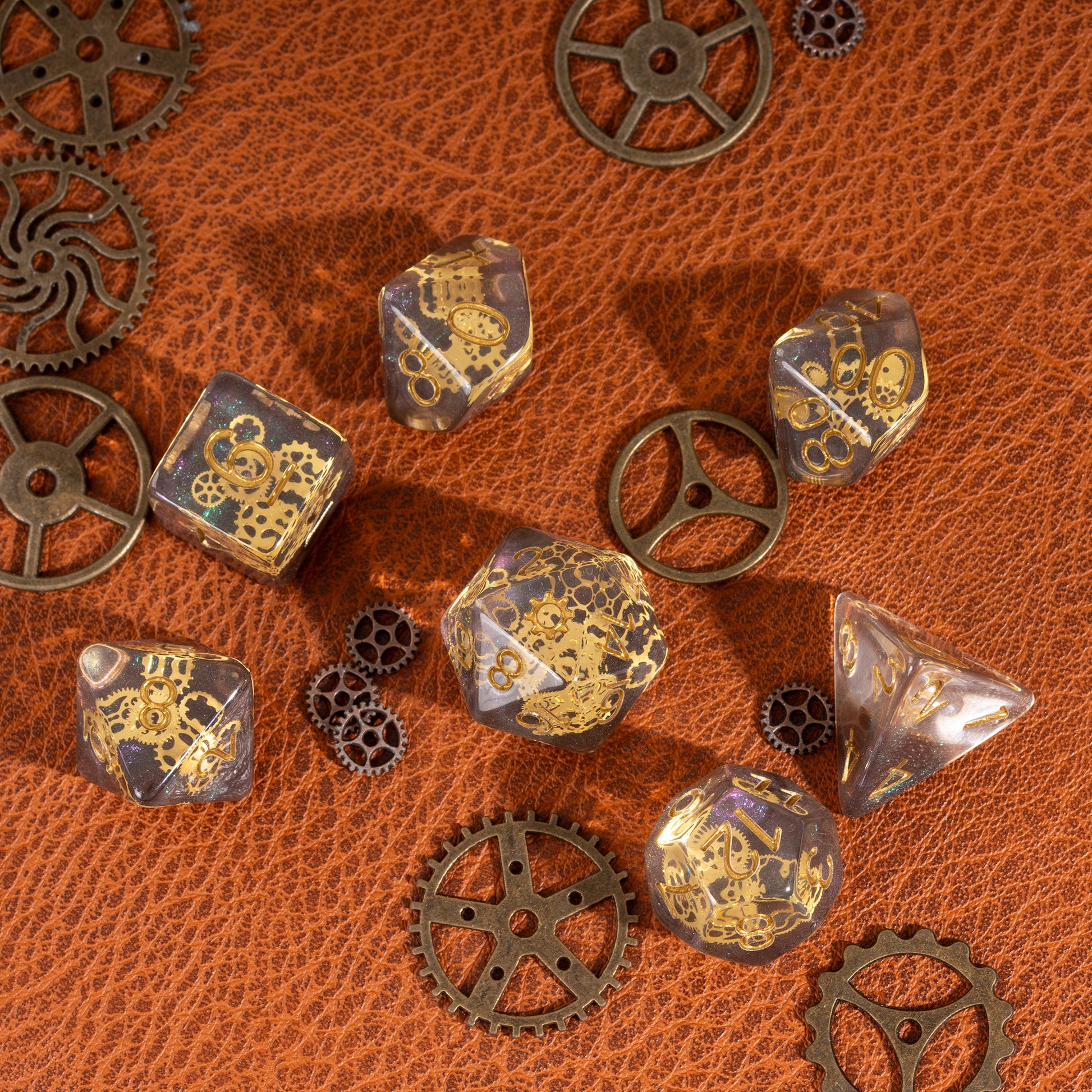 Flux Gearshift Dice Set arranged in a flat lay with decorative steampunk gears on a brown leather background