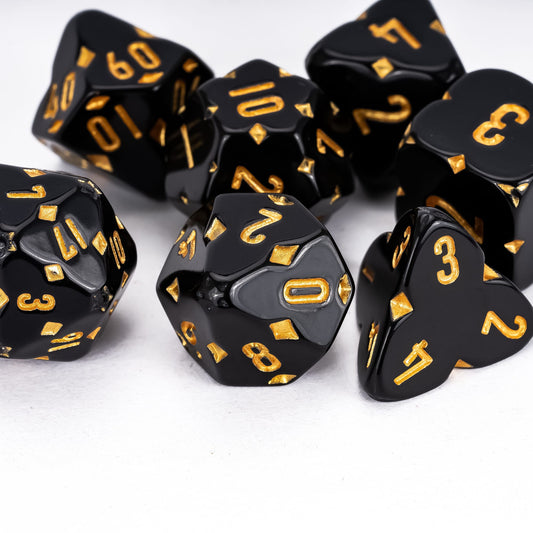 Black Fourfold Clover Dice Set stacked display, 7 RPG dice with clover icons and gold numbering