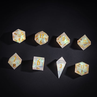Flat lay of Frosted Beam Sharp Edge Dice Set with pearlescent finish for DnD