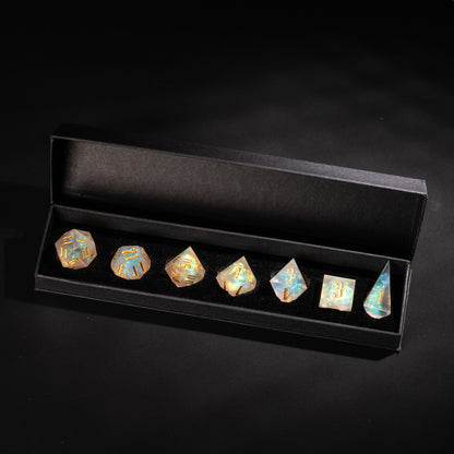 Frosted Beam resin dice set displayed in black box with gold numbers and opalescent finish